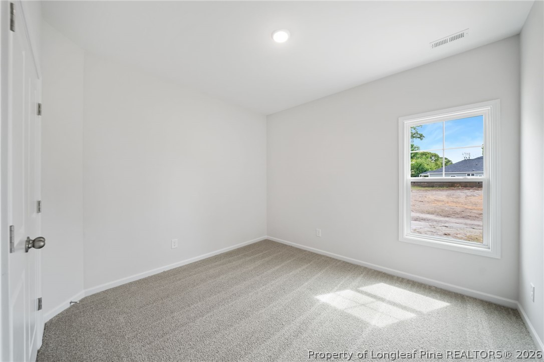 4047 Church Street Wade, NC 28395 - Photo 21 of 30 an empty room with windows