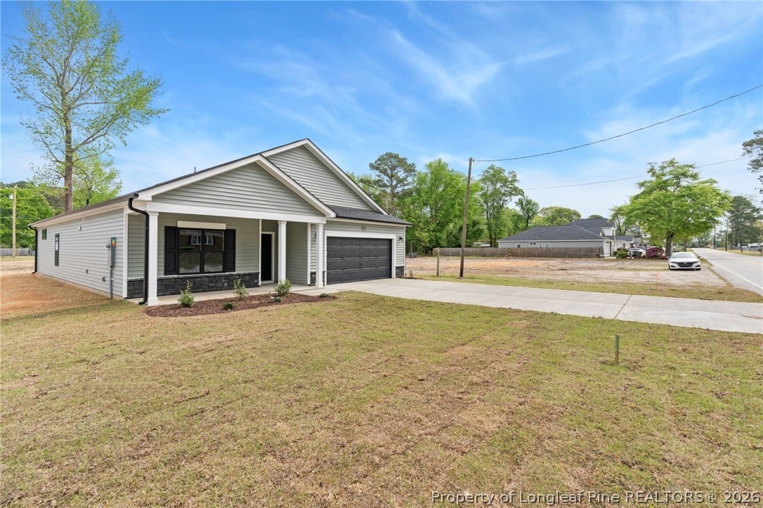 4047 Church Street Wade, NC 28395 - Photo 28 of 30 a view of a house with backyard and tree