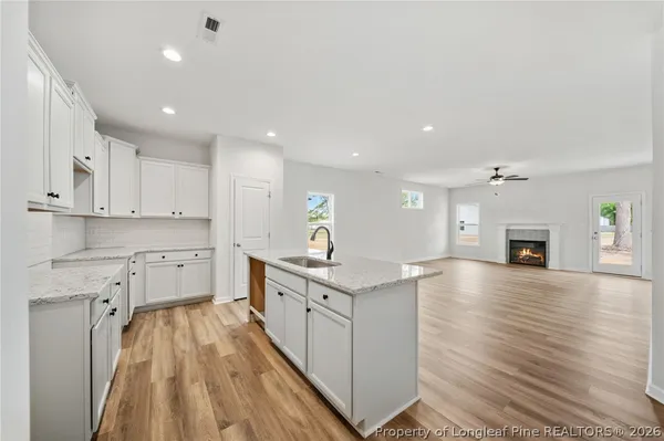 a kitchen with cabinets a sink and appliances