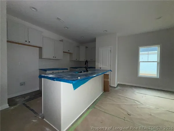 a kitchen with stainless steel appliances granite countertop a stove and a refrigerator