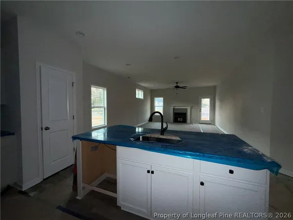 a kitchen with a sink and a refrigerator