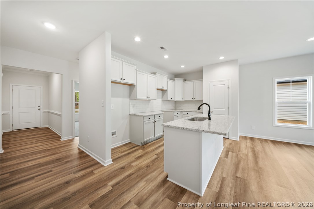 4047 Church Street Wade, NC 28395 - Photo 6 of 30 a view of a kitchen with wooden floor and electronic appliances
