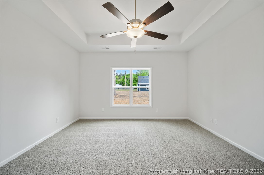 4047 Church Street Wade, NC 28395 - Photo 8 of 30 an empty room with a window and a fan