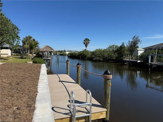 a view of a lake with sitting area