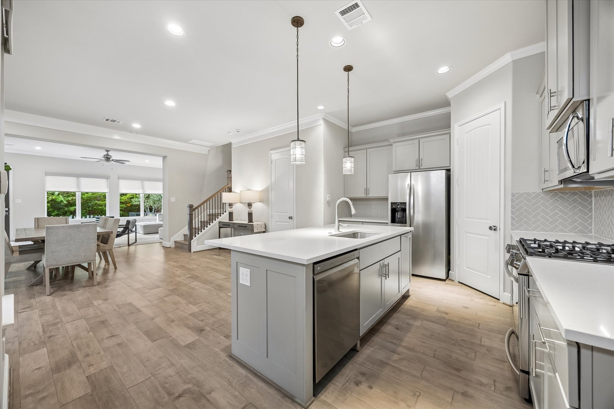 809 Malone Street Houston, TX 77007 - Photo 6 of 26 Kitchen island overlooking the dining and living areas.