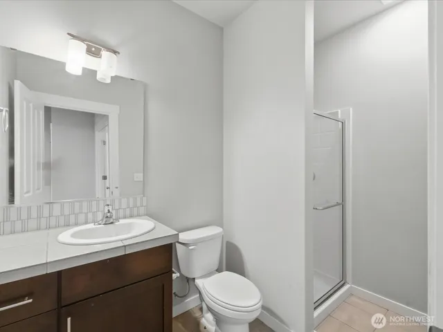 a view of staircase with white walls and a window