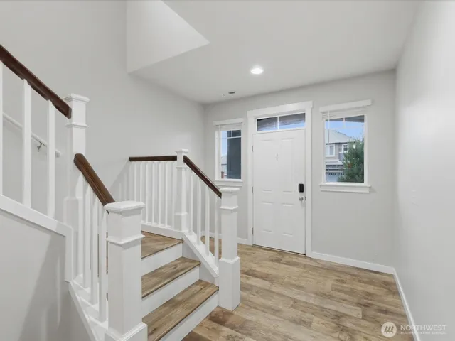 a bedroom with furniture and a potted plant