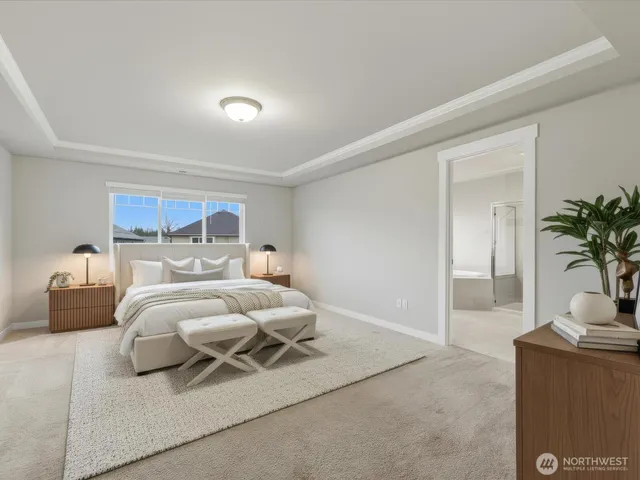 a bathroom with a granite countertop sink a toilet and shower