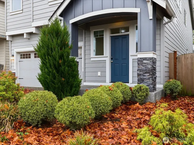 a front view of a house with garden