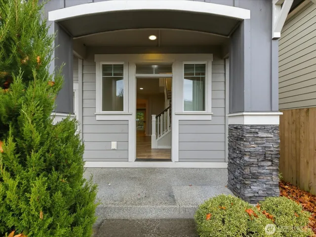 a front view of a house with a garage