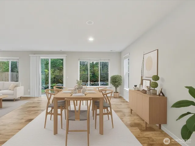 a view of a dining room with furniture window and outside view