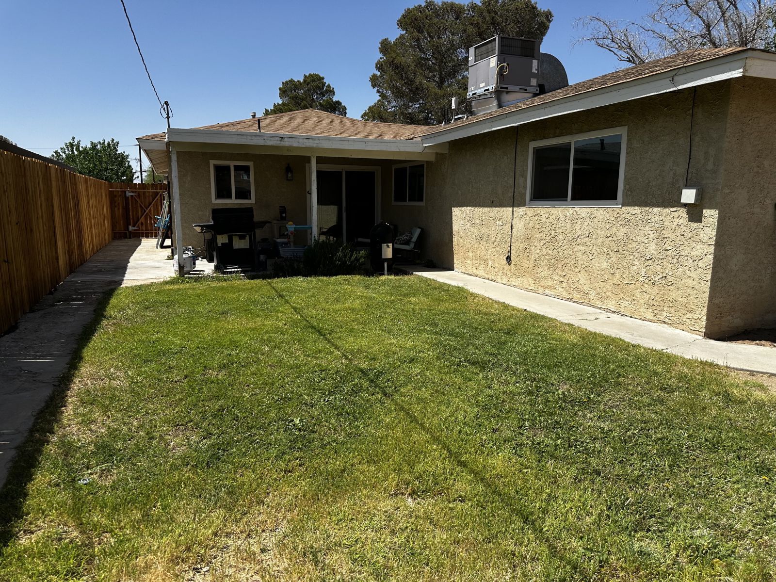 208 South Orchard Street Ridgecrest, CA 93555 - Photo 5 of 26 a view of a house with backyard and porch