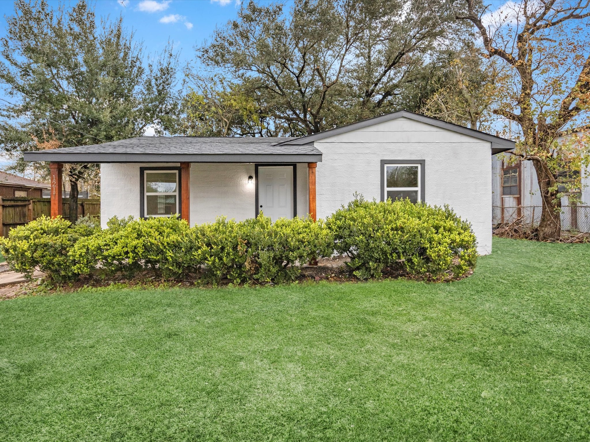 front view of a house with a yard