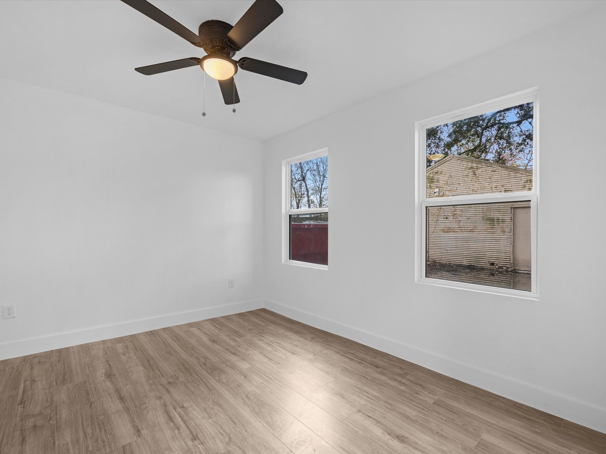 1217 Randall Street Pasadena, TX 77506 - Photo 14 of 16 a view of empty room with wooden floor