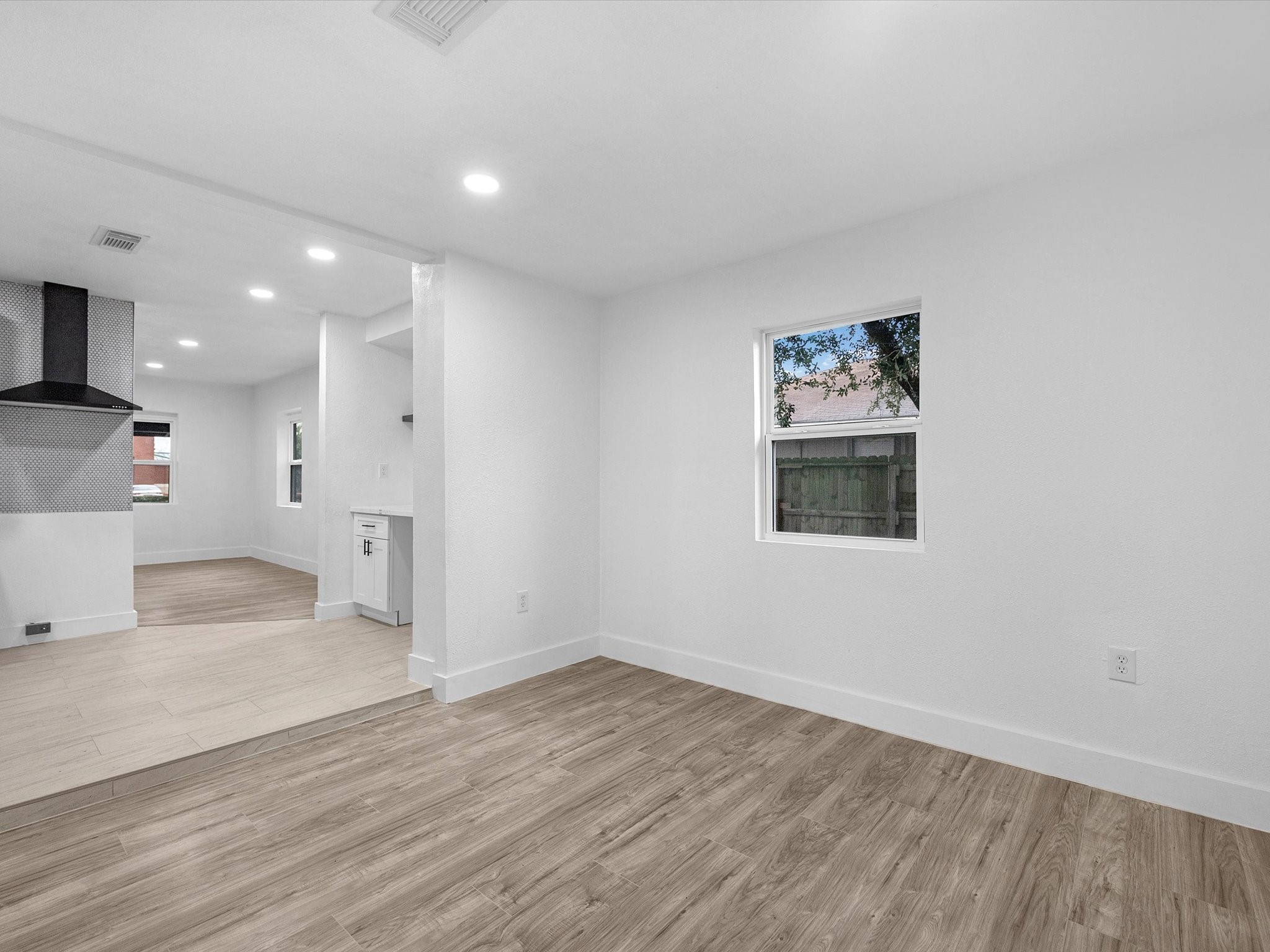 1217 Randall Street Pasadena, TX 77506 - Photo 8 of 16 a view of a big room with wooden floor and windows