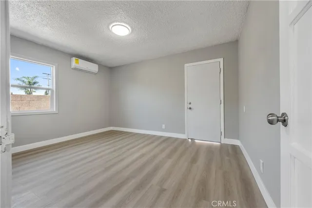 a view of an empty room and a window