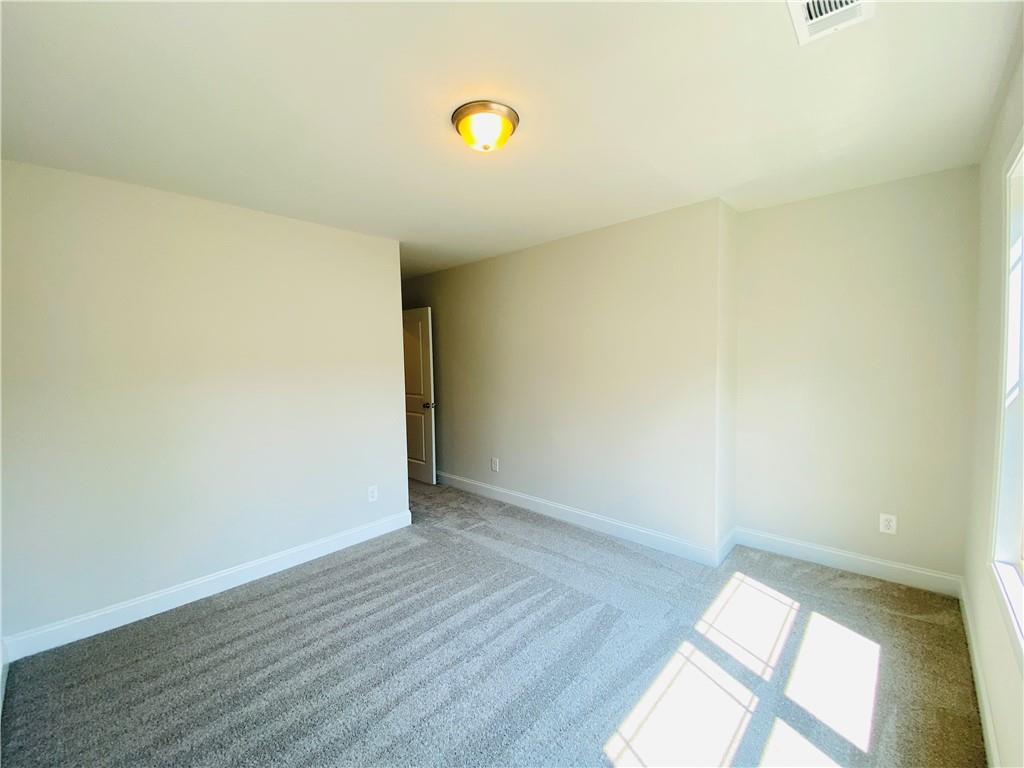 1099 North Village Drive Decatur, GA 30032 - Photo 17 of 23 a view of an empty room and window