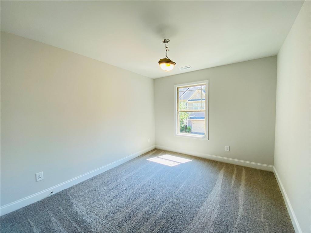 1099 North Village Drive Decatur, GA 30032 - Photo 18 of 23 an empty room with windows