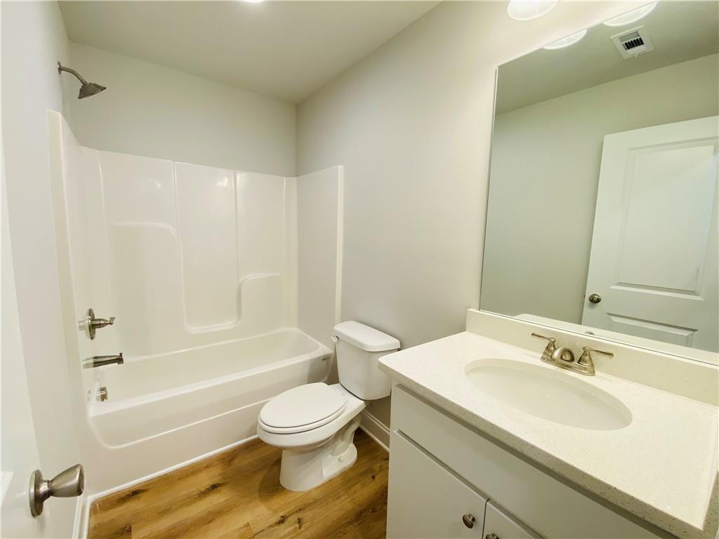 1099 North Village Drive Decatur, GA 30032 - Photo 20 of 23 a bathroom with a sink toilet and shower