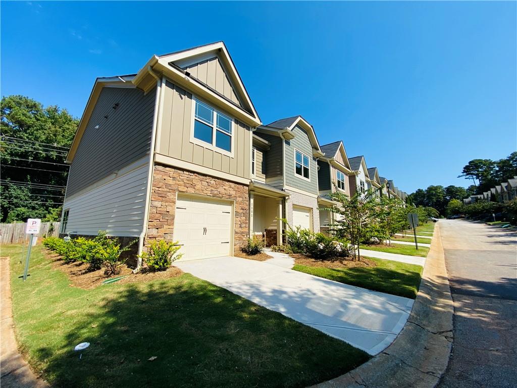 1099 North Village Drive Decatur, GA 30032 - Photo 23 of 23 a front view of a house with a yard