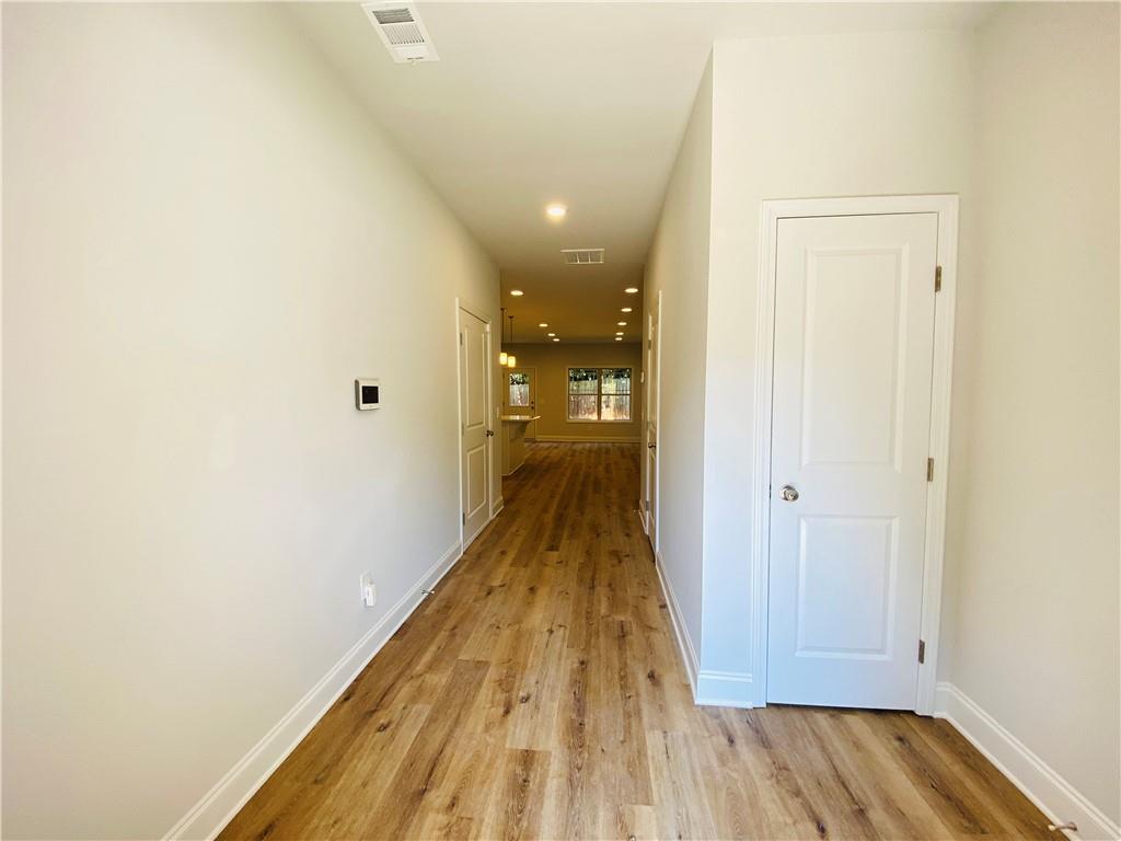 1099 North Village Drive Decatur, GA 30032 - Photo 4 of 23 a view of a hallway with wooden floor