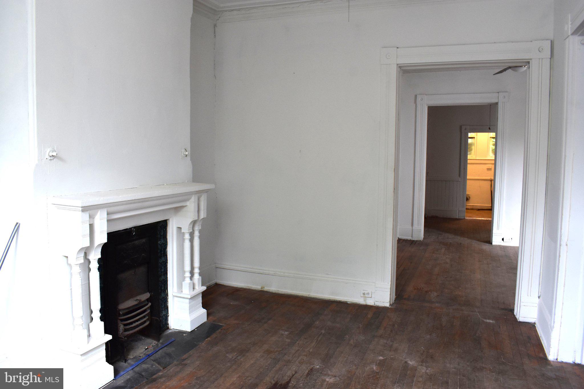 1605 15th Street Northwest Washington, DC 20009 - Photo 3 of 16 Spacious room with classic fireplace.