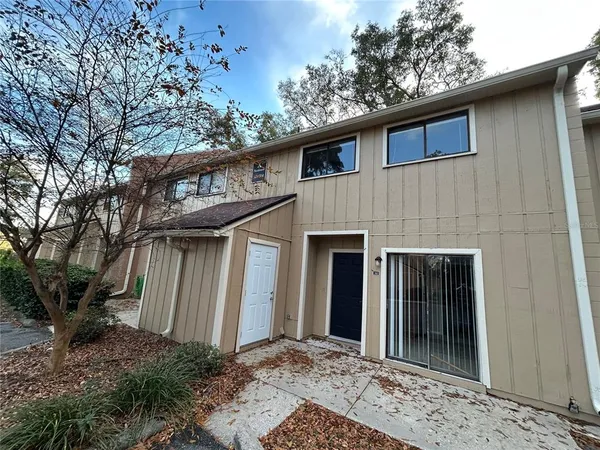 a view of a house with a small yard