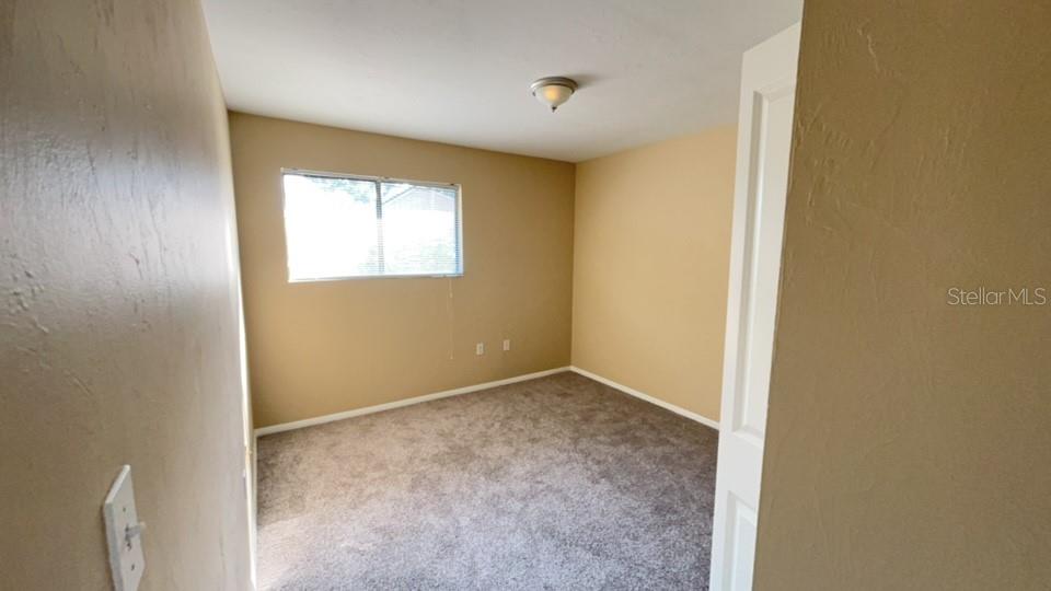 507 Northwest 39th Road, Unit 310 Gainesville, FL 32607 - Photo 13 of 18 a view of an empty room and window