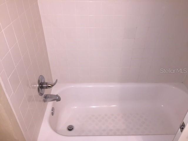 507 Northwest 39th Road, Unit 310 Gainesville, FL 32607 - Photo 15 of 18 a bathroom with a shower