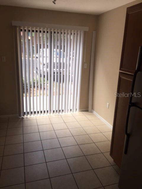507 Northwest 39th Road, Unit 310 Gainesville, FL 32607 - Photo 10 of 18 a view of an empty room with a window