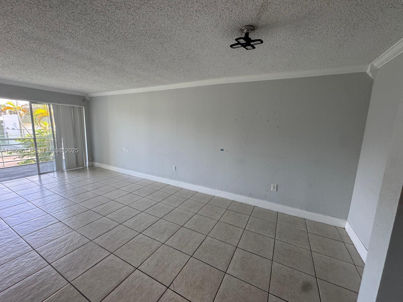 Spring Tree Sunrise, FL 33351 - Photo 2 of 3 an empty room with windows