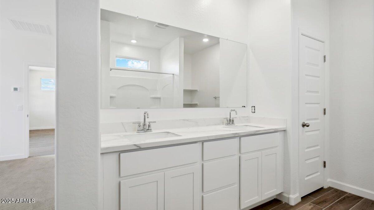 2170 West Starfire Avenue Apache Junction, AZ 85120 - Photo 11 of 26 a bathroom with 2 sink and a mirror
