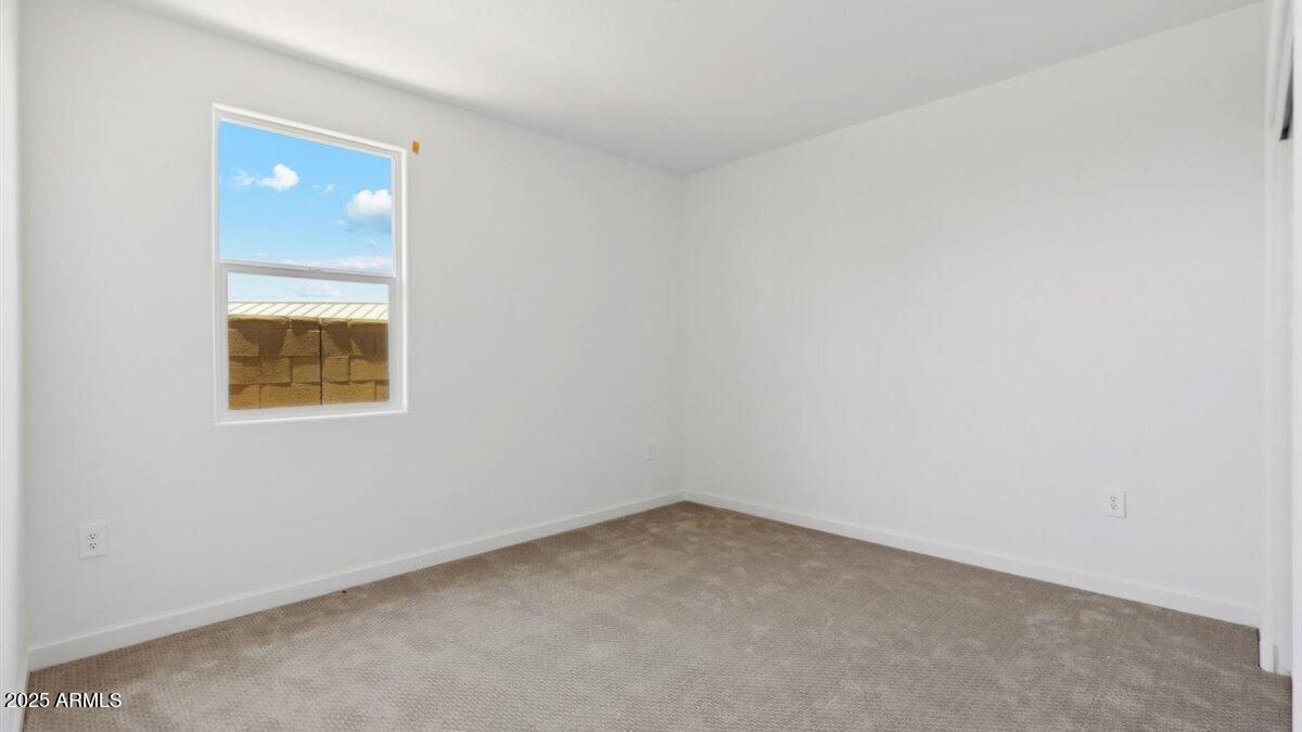 2170 West Starfire Avenue Apache Junction, AZ 85120 - Photo 17 of 26 an empty room with a window