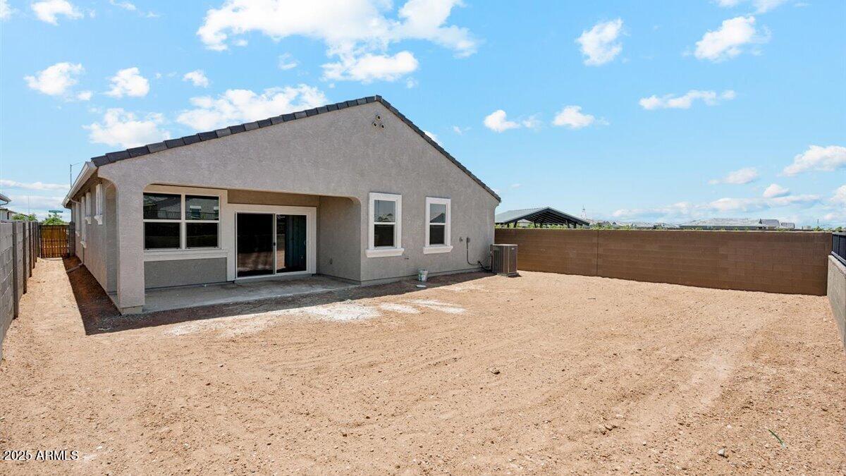 2170 West Starfire Avenue Apache Junction, AZ 85120 - Photo 25 of 26 a house with trees in the background