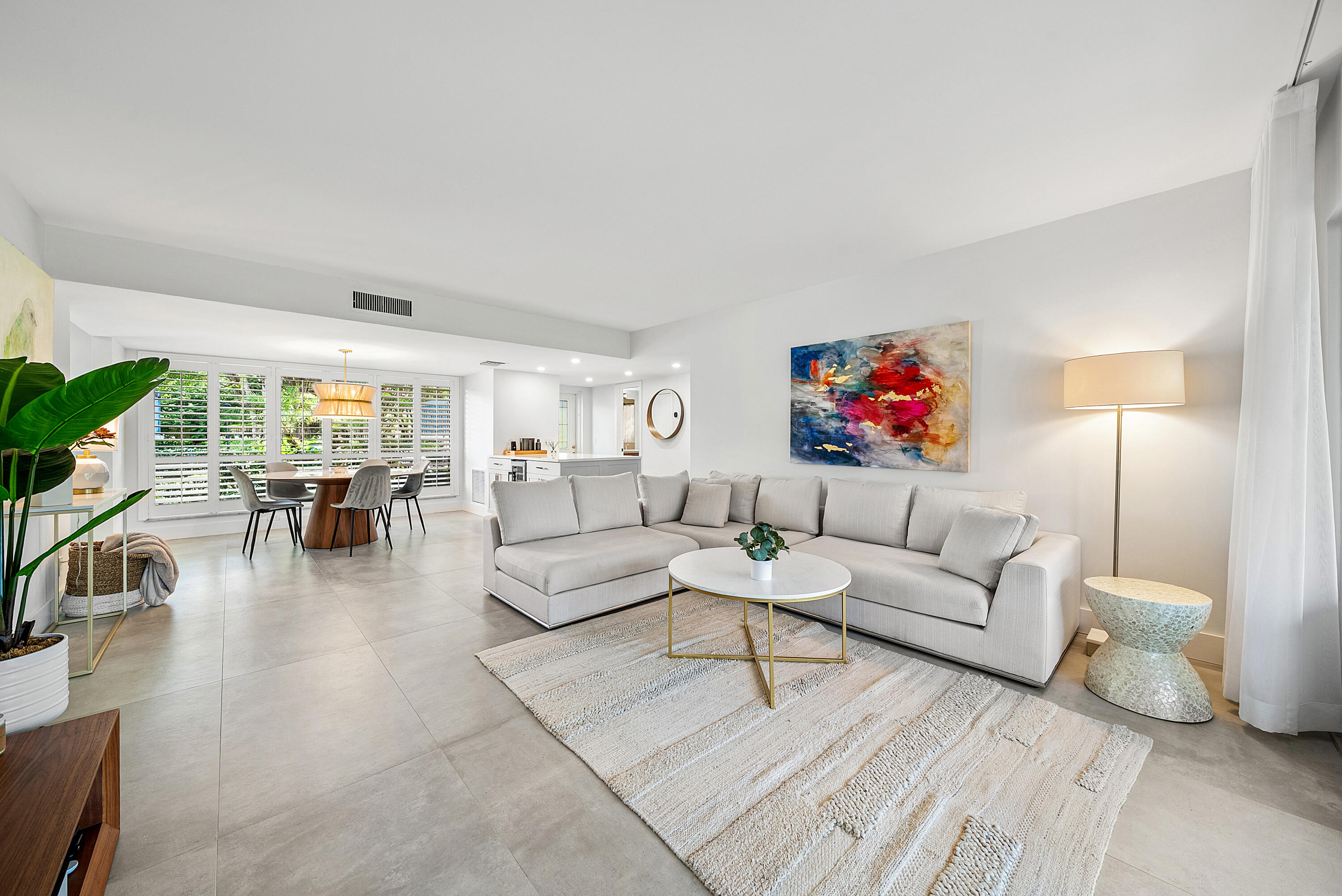 4116 North Quail Ridge Drive, Unit A Boynton Beach, FL 33436 - Photo 2 of 41 a living room with furniture and a flat screen tv