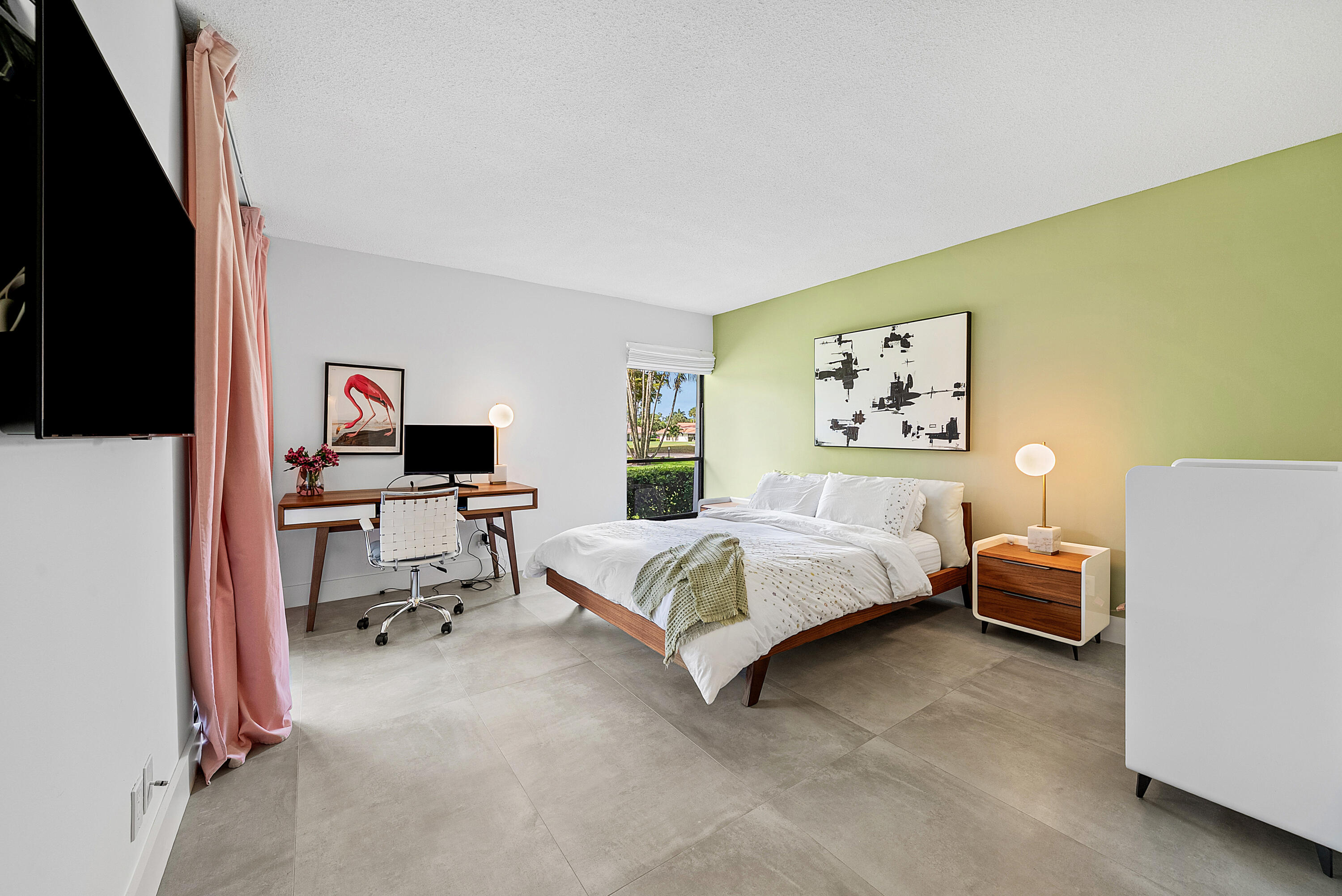 4116 North Quail Ridge Drive, Unit A Boynton Beach, FL 33436 - Photo 23 of 41 a bedroom with a bed and a couch