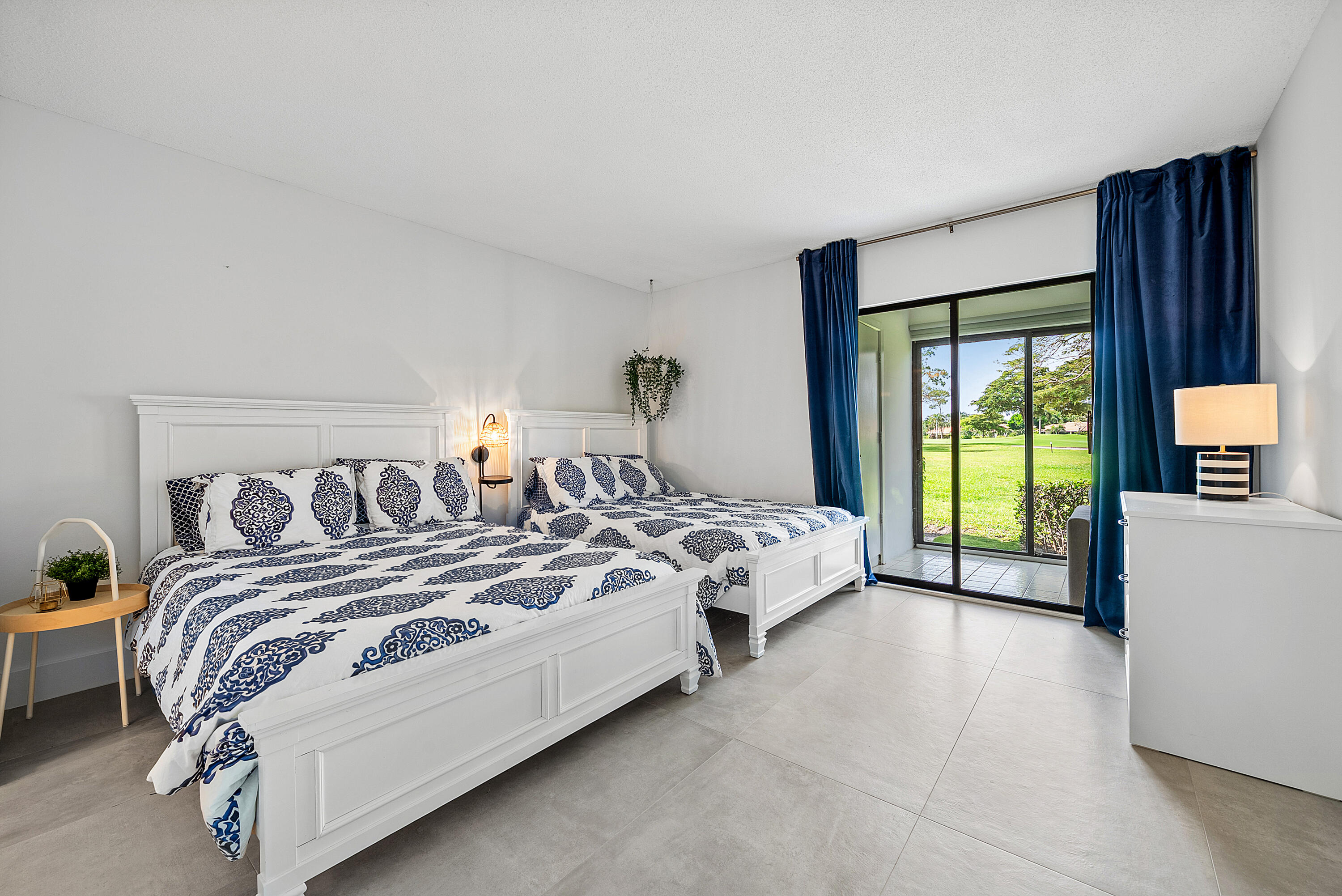 4116 North Quail Ridge Drive, Unit A Boynton Beach, FL 33436 - Photo 26 of 41 a bedroom with bed and a large window