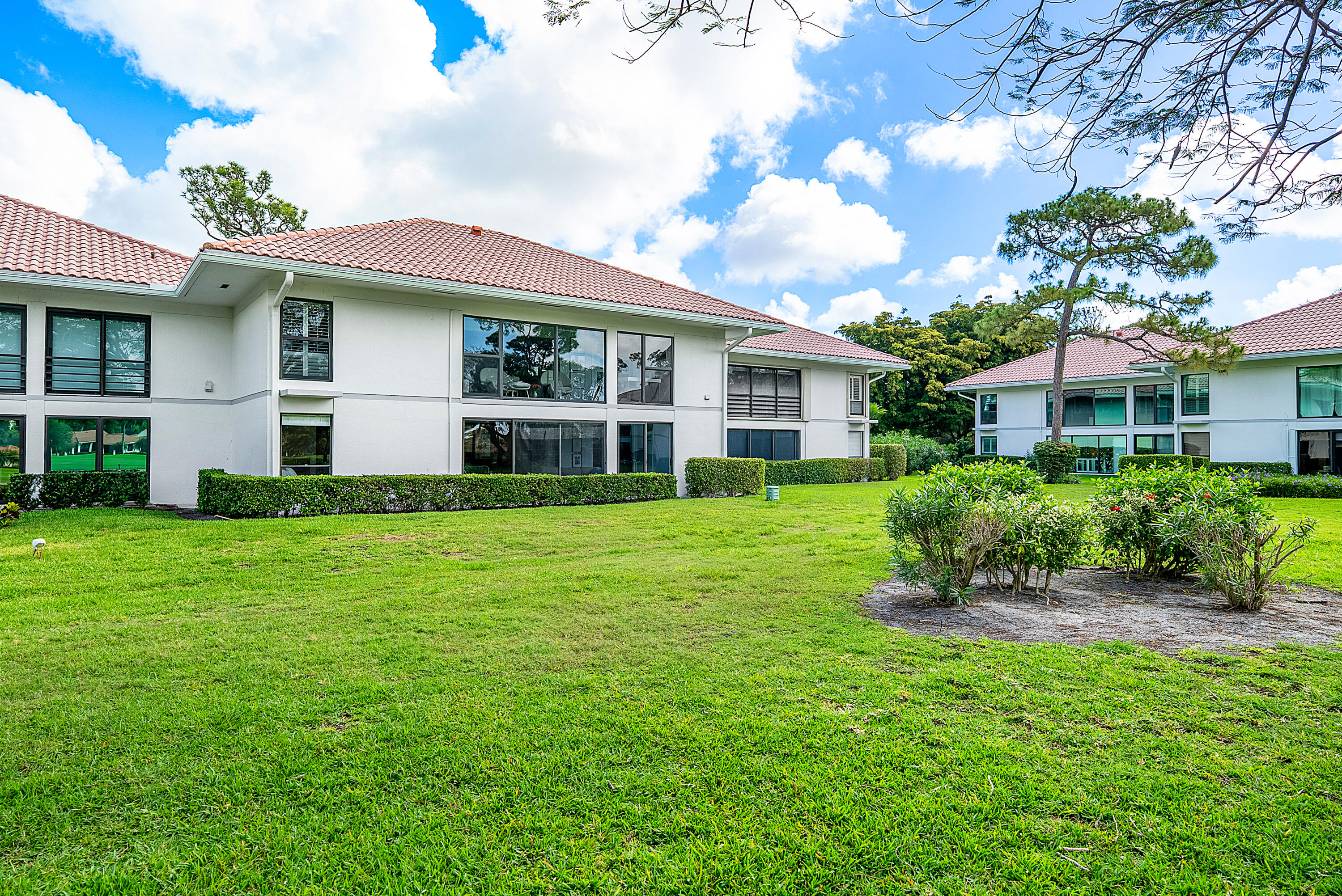 4116 North Quail Ridge Drive, Unit A Boynton Beach, FL 33436 - Photo 32 of 41 a front view of a house with a yard
