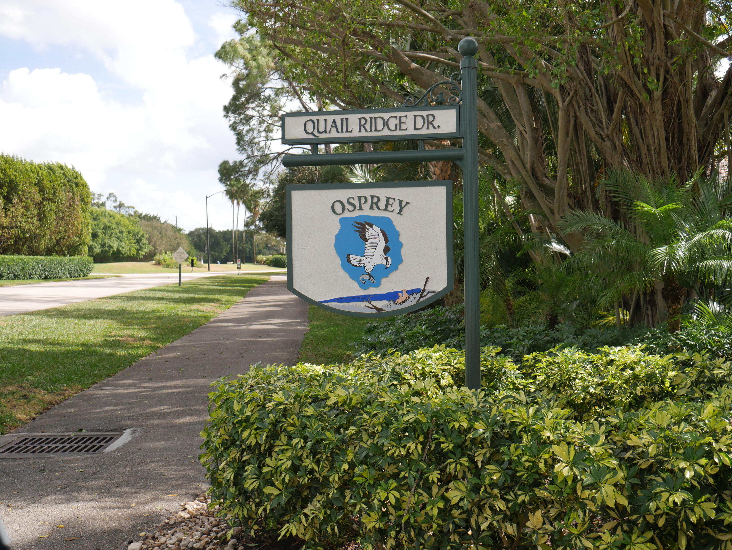 4116 North Quail Ridge Drive, Unit A Boynton Beach, FL 33436 - Photo 34 of 41 a sign on the side of the road