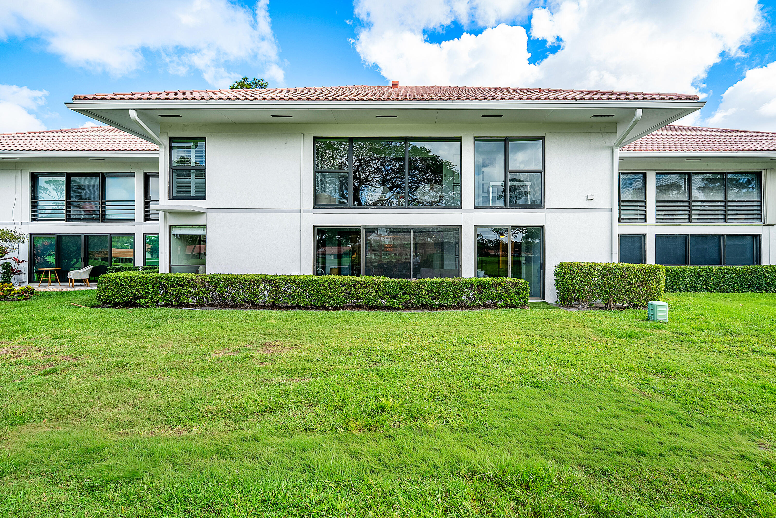 4116 North Quail Ridge Drive, Unit A Boynton Beach, FL 33436 - Photo 35 of 41 a front view of a house with a yard