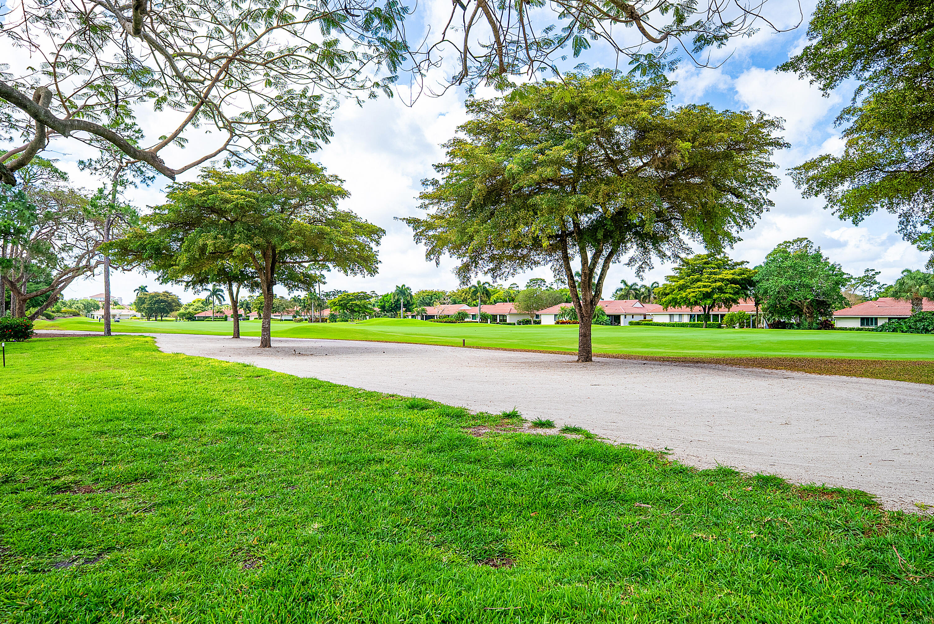 4116 North Quail Ridge Drive, Unit A Boynton Beach, FL 33436 - Photo 36 of 41 a view of outdoor space with garden and trees