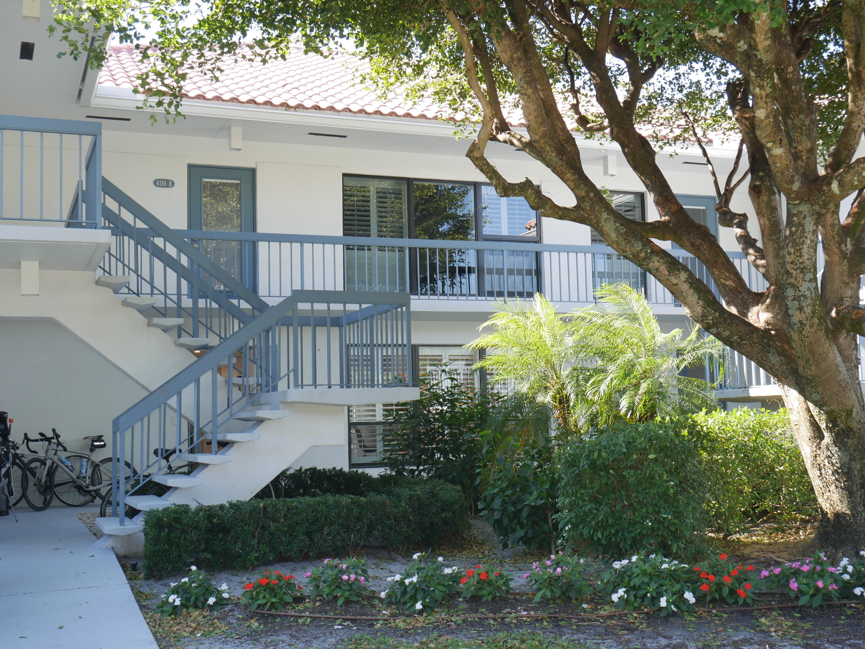 4116 North Quail Ridge Drive, Unit A Boynton Beach, FL 33436 - Photo 38 of 41 a front view of a house with garden