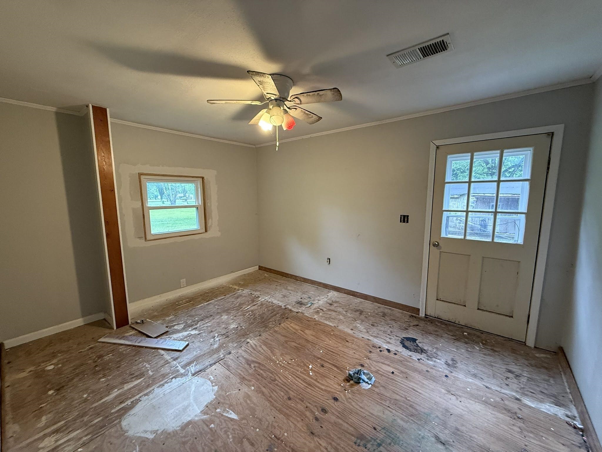 2102 Campbell Road Millington, TN 38053 - Photo 3 of 18 Interior space featuring light-colored walls, exposed subflooring, and a ceiling-mounted fan with integrated lighting