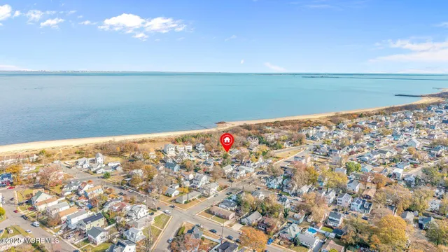 an aerial view of beach and city