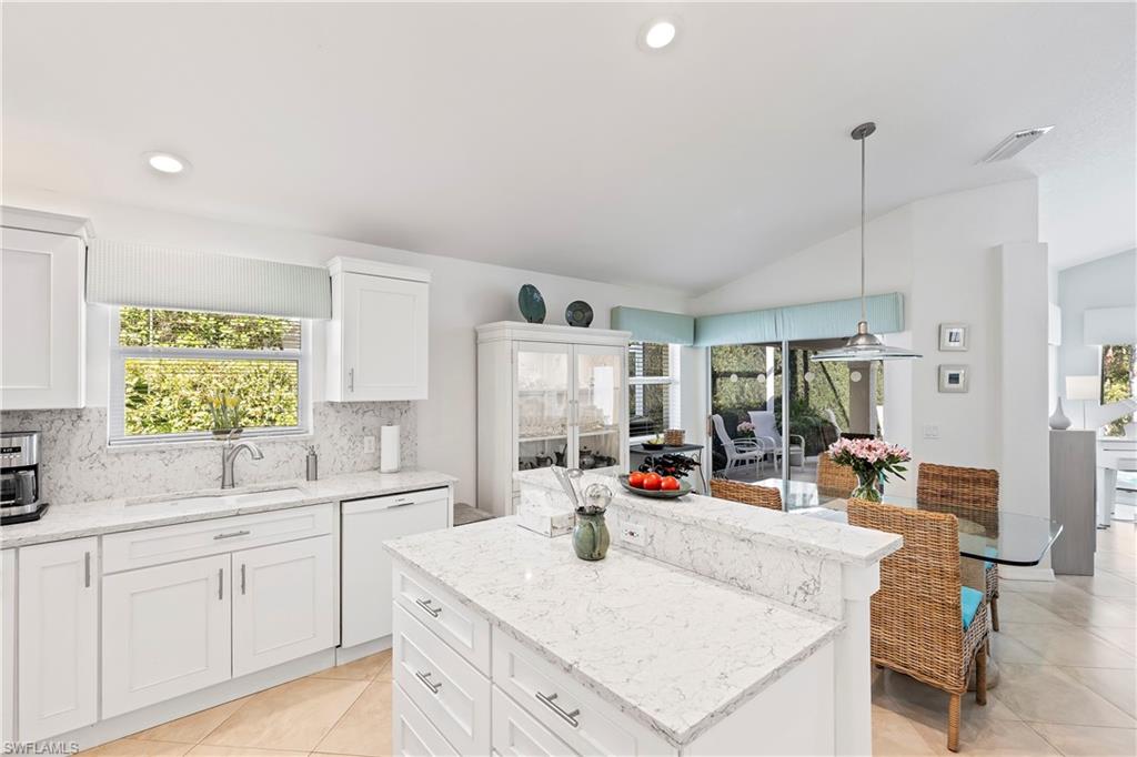 1269 Silverstrand Drive Naples, FL 34110 - Photo 4 of 43 Updated kitchen with quartz counters and shaker style cabinets.