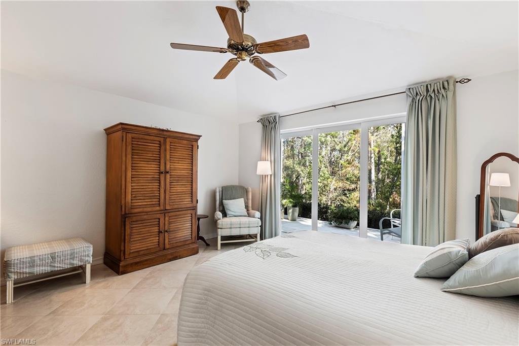1269 Silverstrand Drive Naples, FL 34110 - Photo 6 of 43 Spacious primary bedroom overlooking wooded preserve.