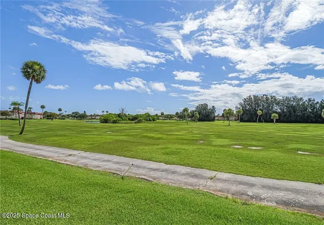 a view of a golf course with a lake