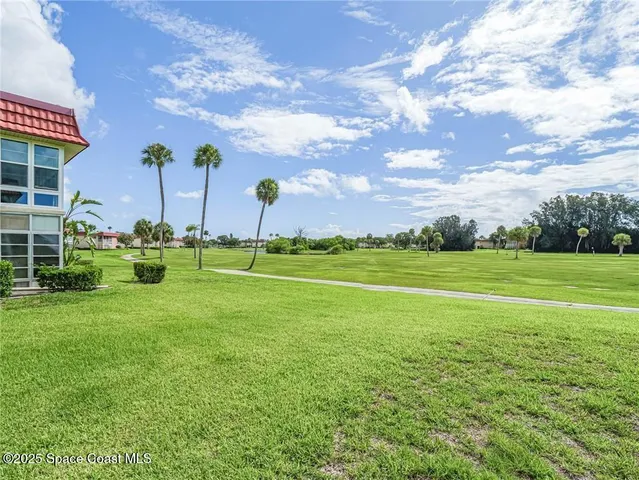 a view of a golf course with a swimming pool