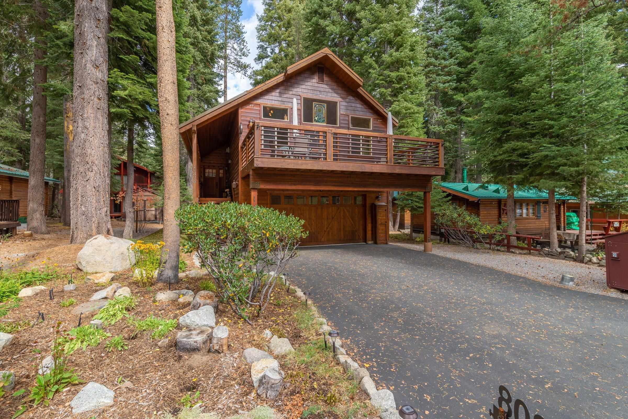 10308 Washoe Road Truckee, CA 96161 - Photo 1 of 21 a front view of a house with a yard and garage