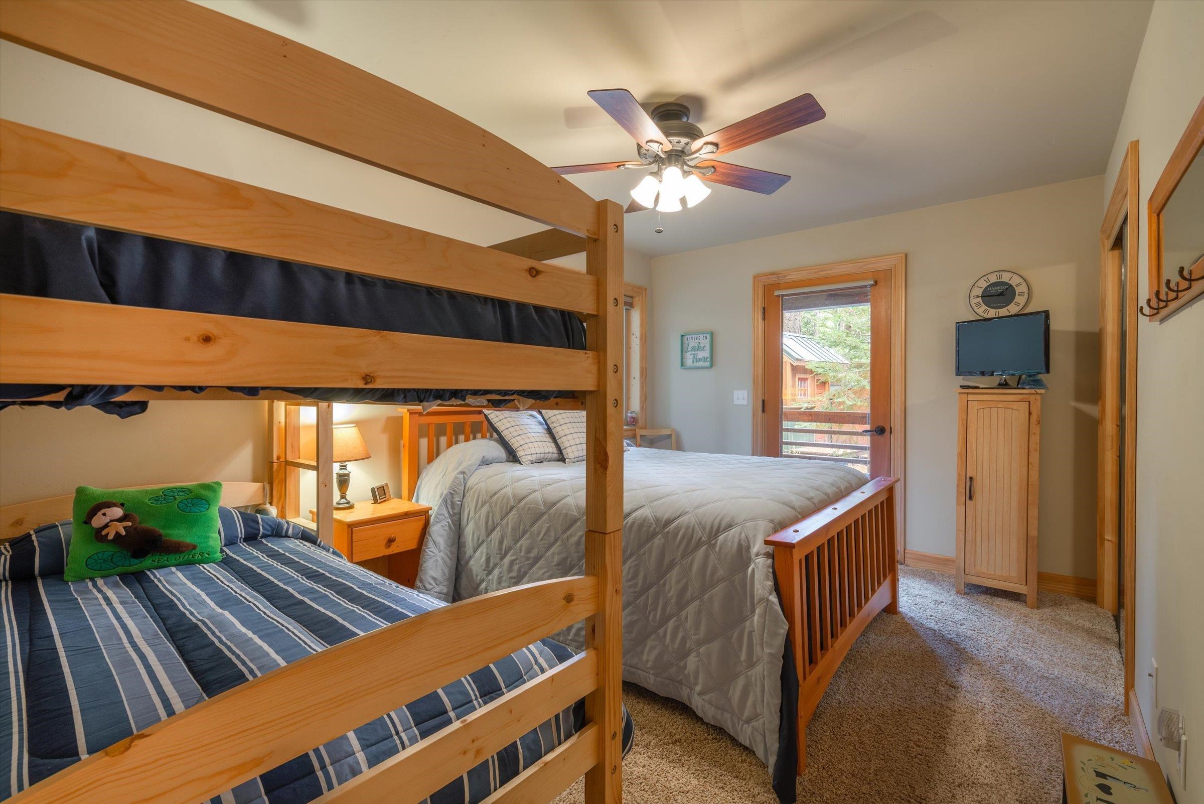 10308 Washoe Road Truckee, CA 96161 - Photo 18 of 21 a bedroom with bed and wooden floor